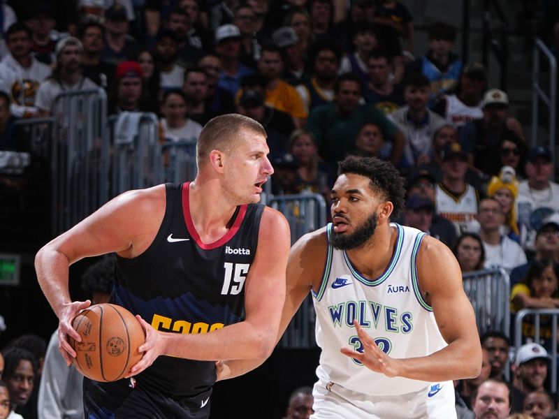 DENVER, CO - MAY 19:  Karl-Anthony Towns #32 of the Minnesota Timberwolves plays defense during the game  against Nikola Jokic #15 of the Denver Nuggets during Round 2 Game 7 of the 2024 NBA Playoffs  on May 19, 2024 at the Ball Arena in Denver, Colorado. NOTE TO USER: User expressly acknowledges and agrees that, by downloading and/or using this Photograph, user is consenting to the terms and conditions of the Getty Images License Agreement. Mandatory Copyright Notice: Copyright 2024 NBAE (Photo by Garrett Ellwood/NBAE via Getty Images)