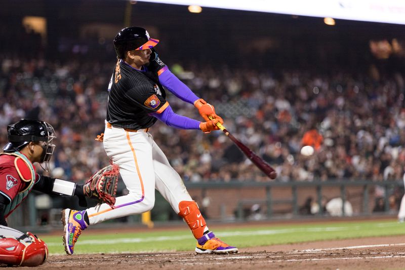 May 13, 2025; San Francisco, California, USA; San Francisco Giants shortstop Willy Adames (2) hits a two-run home run against the Arizona Diamondbacks during the fifth inning at Oracle Park. Mandatory Credit: John Hefti-Imagn Images