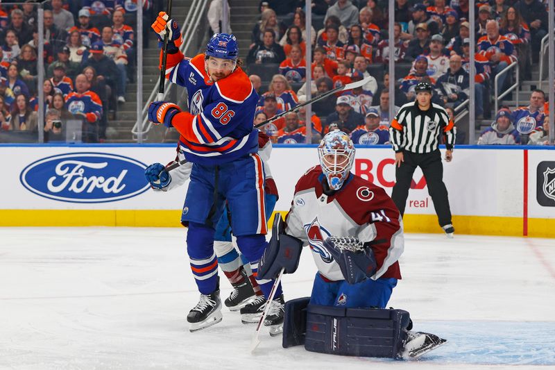 Nov 8, 2025; Edmonton, Alberta, CAN; Edmonton Oilers forward David Tomasek (86) and Colorado Avalanche goaltender Scott Wedgewood (41) looks for a loose puck during the first period at Rogers Place. Mandatory Credit: Perry Nelson-Imagn Images