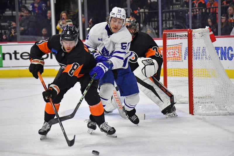 Mar 19, 2024; Philadelphia, Pennsylvania, USA; Philadelphia Flyers defenseman Cam York (8) keeps the puck away from Toronto Maple Leafs left wing Tyler Bertuzzi (59) during the second period at Wells Fargo Center. Mandatory Credit: Eric Hartline-USA TODAY Sports