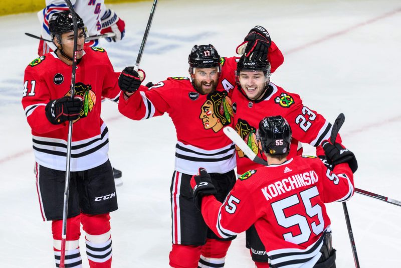 Feb 9, 2024; Chicago, Illinois, USA; Chicago Blackhawks left wing Nick Foligno (17) celebrates his goal with teammates against the New York Rangers during the third period at the United Center. Mandatory Credit: Daniel Bartel-USA TODAY Sports