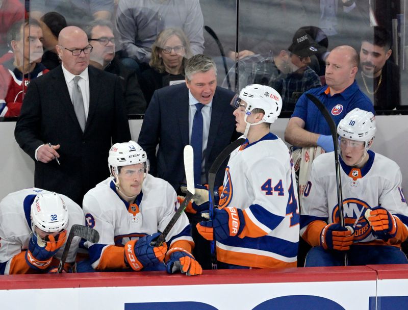 Jan 25, 2024; Montreal, Quebec, CAN; New York Islanders head coach Patrick Roy talks to forward Jean-Gabriel Pageau during the first period of the game against the Montreal Canadiens at the Bell Centre. Mandatory Credit: Eric Bolte-USA TODAY Sports
