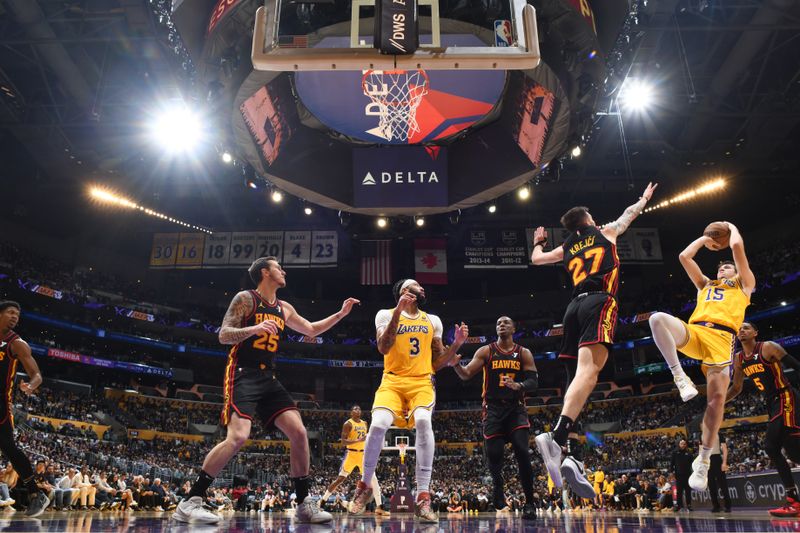 LOS ANGELES, CA - MARCH 18:  Austin Reaves #15 of the Los Angeles Lakers shoots the ball during the game  on March 18, 2024 at Crypto.Com Arena in Los Angeles, California. NOTE TO USER: User expressly acknowledges and agrees that, by downloading and/or using this Photograph, user is consenting to the terms and conditions of the Getty Images License Agreement. Mandatory Copyright Notice: Copyright 2024 NBAE (Photo by Adam Pantozzi/NBAE via Getty Images)