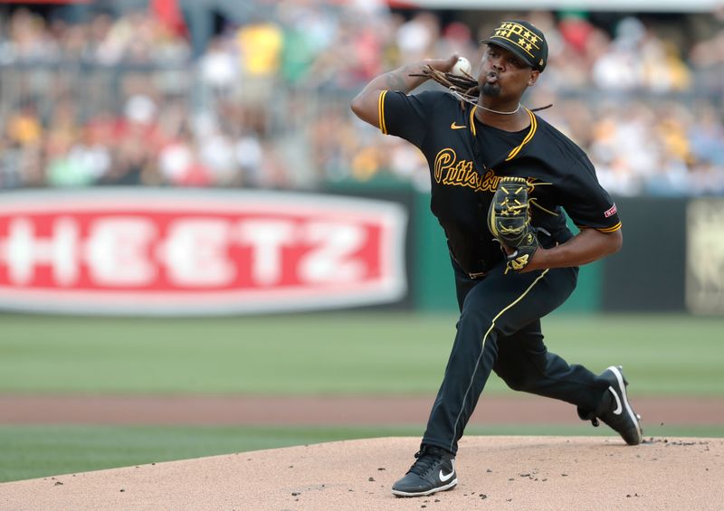 Jul 20, 2024; Pittsburgh, Pennsylvania, USA;  Pittsburgh Pirates starting pitcher Luis L. Ortiz (48) delivers against the Philadelphia Phillies during the first inning at PNC Park. Mandatory Credit: Charles LeClaire-USA TODAY Sports