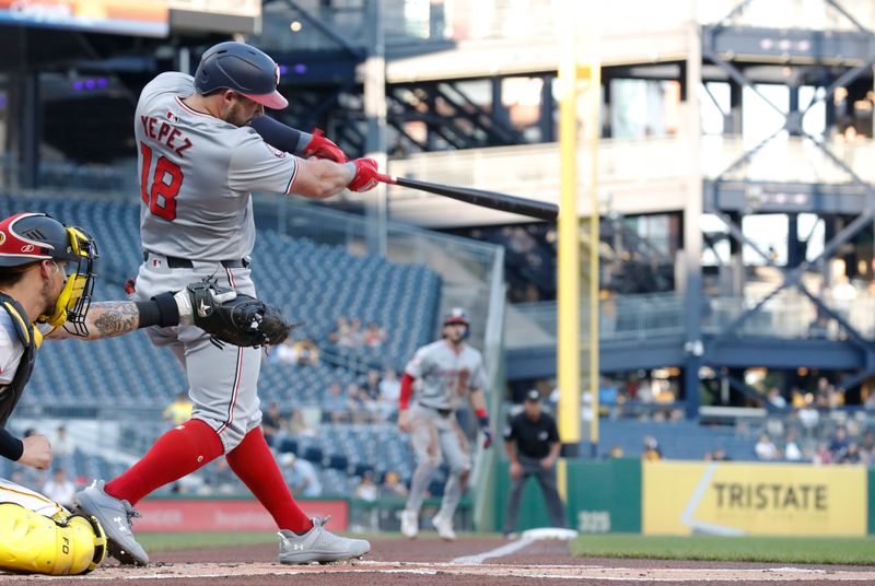 Sep 5, 2024; Pittsburgh, Pennsylvania, USA;  Washington Nationals first baseman Juan Yepez (18) hits a RBI double against the Pittsburgh Pirates during the first inning at PNC Park. Mandatory Credit: Charles LeClaire-Imagn Images