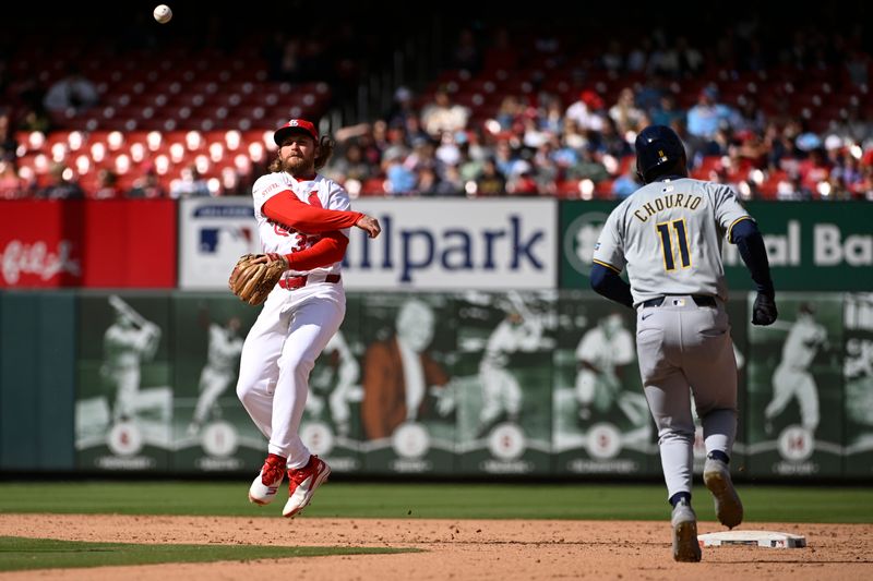 Apr 20, 2024; St. Louis, Missouri, USA; Milwaukee Brewers right fielder Jackson Chourio (11) is called out at second base as St. Louis Cardinals second baseman Brendan Donovan (33) turns a double play in the ninth inning at Busch Stadium. Mandatory Credit: Joe Puetz-USA TODAY Sports