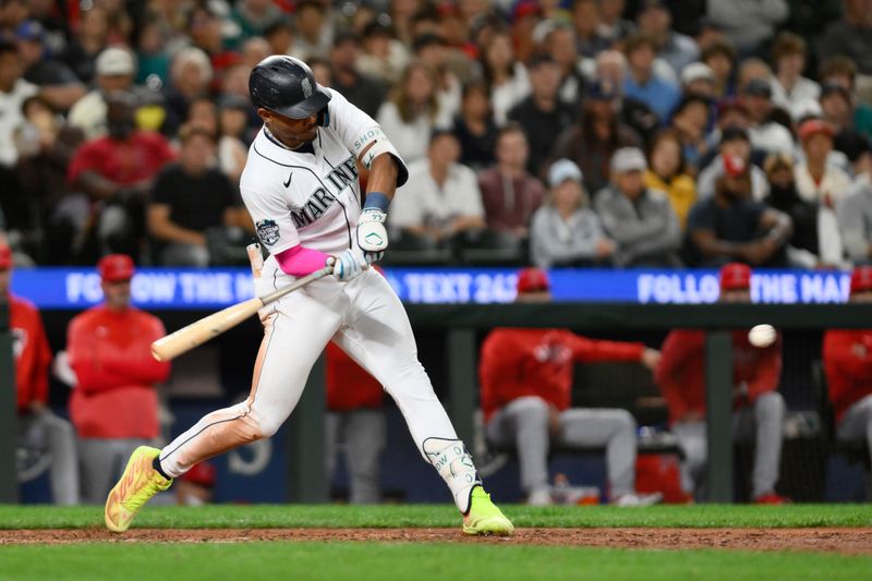 Sep 11, 2023; Seattle, Washington, USA; Seattle Mariners center fielder Julio Rodriguez (44) hits a single against the Los Angeles Angels during the eighth inning at T-Mobile Park. Mandatory Credit: Steven Bisig-USA TODAY Sports