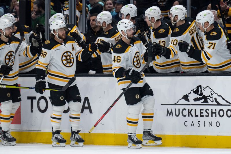 Feb 23, 2023; Seattle, Washington, USA; Boston Bruins forward David Krejci (46) is congratulated by teammates on the bench after scoring a goal during the first period against the Seattle Kraken at Climate Pledge Arena. Mandatory Credit: Stephen Brashear-USA TODAY Sports