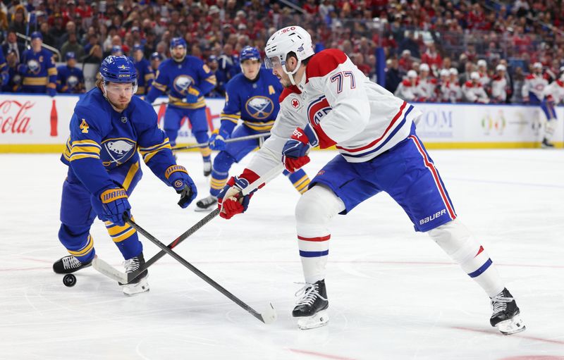 Jan 31, 2026; Buffalo, New York, USA;  Buffalo Sabres defenseman Bowen Byram (4) tries to block a shot by Montréal Canadiens center Kirby Dach (77) during the first period at KeyBank Center. Mandatory Credit: Timothy T. Ludwig-Imagn Images