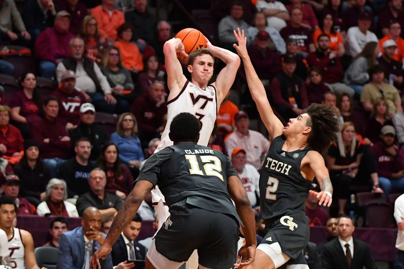 Jan 27, 2024; Blacksburg, Virginia, USA; Virginia Tech Hokies guard Sean Pedulla (3) looks to pass while being defended by Georgia Tech Yellow Jackets forward Tyzhaun Claude (12) and Georgia Tech Yellow Jackets guard Naithan George (2) during the second half at Cassell Coliseum. Mandatory Credit: Brian Bishop-USA TODAY Sports