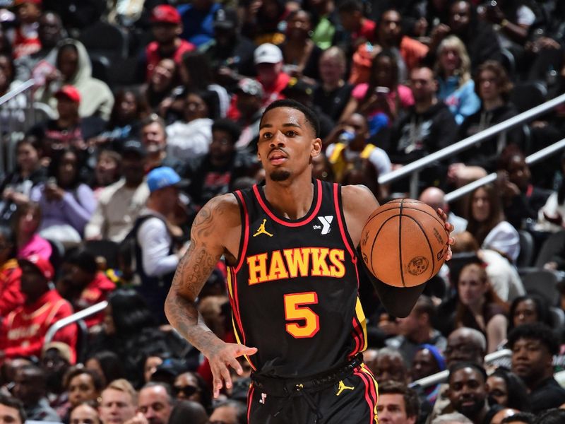 ATLANTA, GA - February 23: Dejounte Murray #5 of the Atlanta Hawks handles the ball during the game against the Toronto Raptors on February 23, 2024 at State Farm Arena in Atlanta, Georgia.  NOTE TO USER: User expressly acknowledges and agrees that, by downloading and/or using this Photograph, user is consenting to the terms and conditions of the Getty Images License Agreement. Mandatory Copyright Notice: Copyright 2024 NBAE (Photo by Scott Cunningham/NBAE via Getty Images)