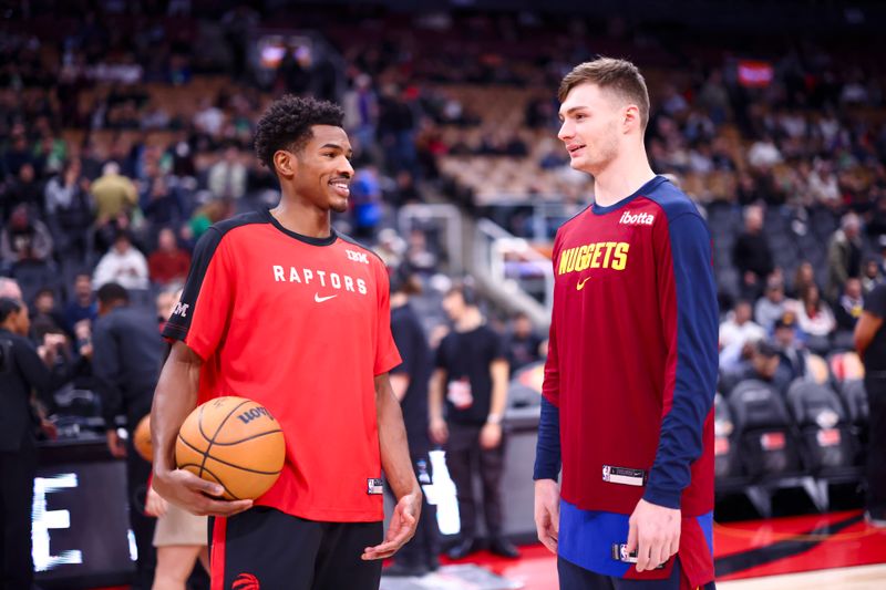 TORONTO, CANADA - OCTOBER 28: Ochai Agbaji #30 of the Toronto Raptors and Christian Braun #0 of the Denver Nuggets talk before the Denver Nuggets vs Toronto Raptors game on October 28, 2024 at the Scotiabank Arena in Toronto, Ontario, Canada.  NOTE TO USER: User expressly acknowledges and agrees that, by downloading and or using this Photograph, user is consenting to the terms and conditions of the Getty Images License Agreement.  Mandatory Copyright Notice: Copyright 2024 NBAE (Photo by Vaughn Ridley/NBAE via Getty Images)