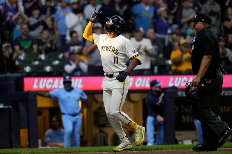 Jun 10, 2024; Milwaukee, Wisconsin, USA;  Milwaukee Brewers right fielder Jackson Chourio (11) celebrates after hitting a home run during the third inning against the Toronto Blue Jays at American Family Field. Mandatory Credit: Jeff Hanisch-USA TODAY Sports