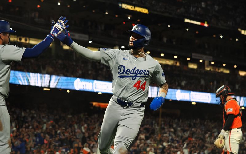 Jun 28, 2024; San Francisco, California, USA; Los Angeles Dodgers center fielder Andy Pages (44) celebrates after scoring the tying run against the San Francisco Giants during the ninth inning at Oracle Park. Mandatory Credit: Kelley L Cox-USA TODAY Sports