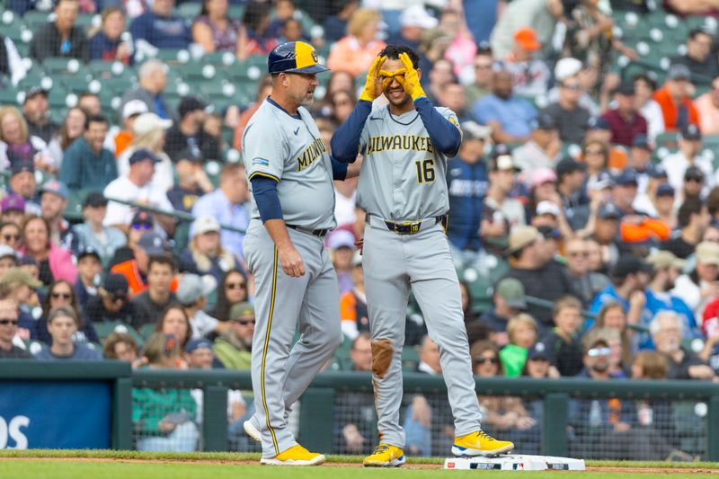 Jun 7, 2024; Detroit, Michigan, USA; Milwaukee Brewers outfielder Blake Perkins (16) signals to the dugout during the second inning of the game against the Detroit Tigers at Comerica Park. Mandatory Credit: Brian Bradshaw Sevald-USA TODAY Sports