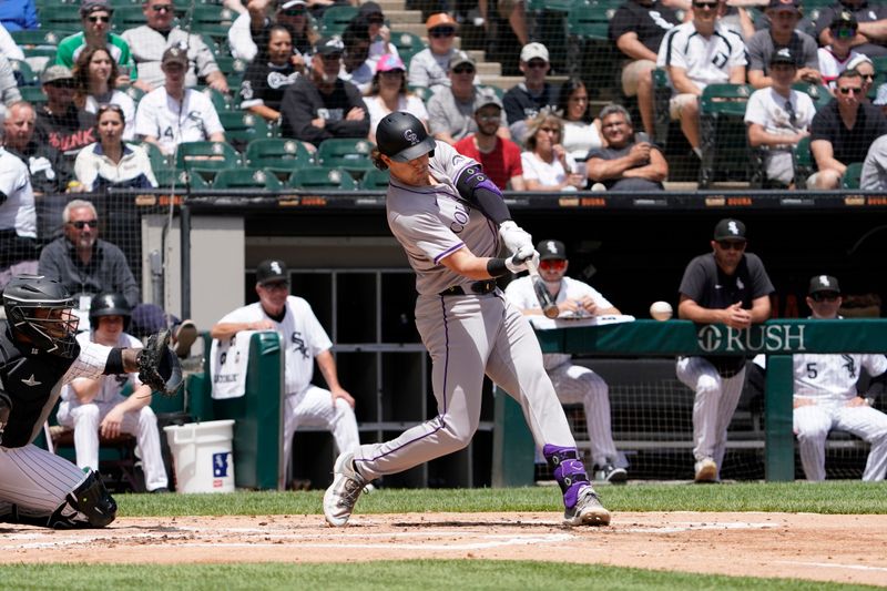 Jun 30, 2024; Chicago, Illinois, USA; Colorado Rockies first base Michael Toglia (4) hits a single against the Chicago White Sox during the second inning at Guaranteed Rate Field. Mandatory Credit: David Banks-USA TODAY Sports