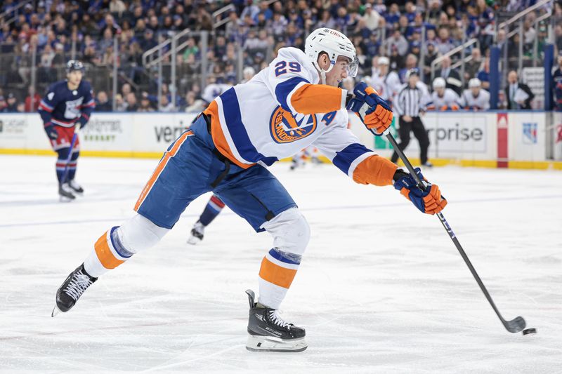 Mar 17, 2024; New York, New York, USA; New York Islanders center Brock Nelson (29) shoots the puck against the New York Rangers during the first period at Madison Square Garden. Mandatory Credit: Vincent Carchietta-USA TODAY Sports