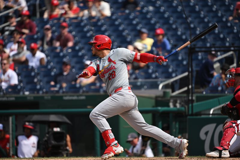 Jul 7, 2024; Washington, District of Columbia, USA; St. Louis Cardinals third baseman Nolan Arenado (28) hits a single against the Washington Nationals during the seventh inning at Nationals Park. Mandatory Credit: Rafael Suanes-USA TODAY Sports