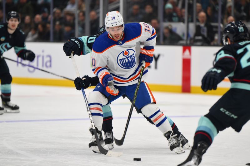 Mar 2, 2024; Seattle, Washington, USA; Edmonton Oilers center Derek Ryan (10) plays the puck against the Seattle Kraken during the first period at Climate Pledge Arena. Mandatory Credit: Steven Bisig-USA TODAY Sports