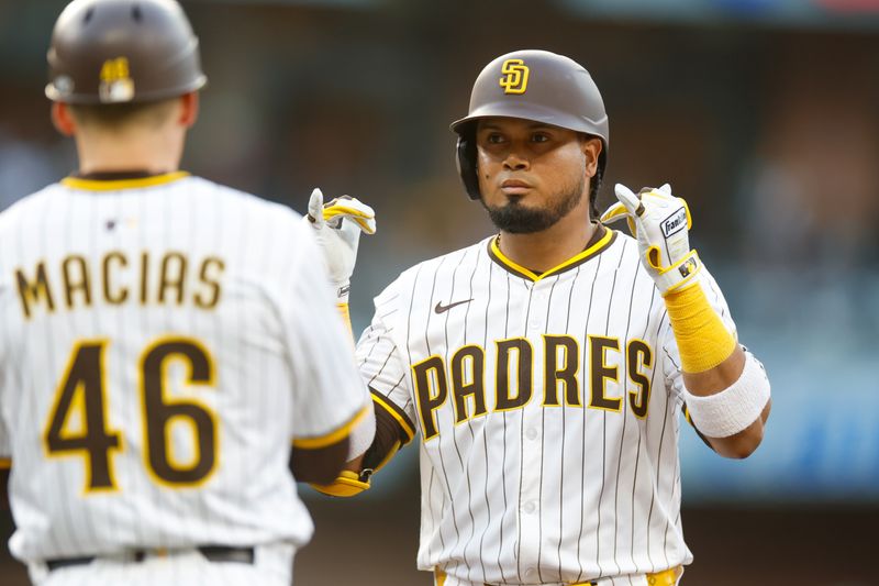 Jun 9, 2025; San Diego, California, USA; San Diego Padres first baseman Luis Arraez (4) celebrates with the dugout after hitting a single during the first inning against the Los Angeles Dodgers at Petco Park. Mandatory Credit: David Frerker-Imagn Images