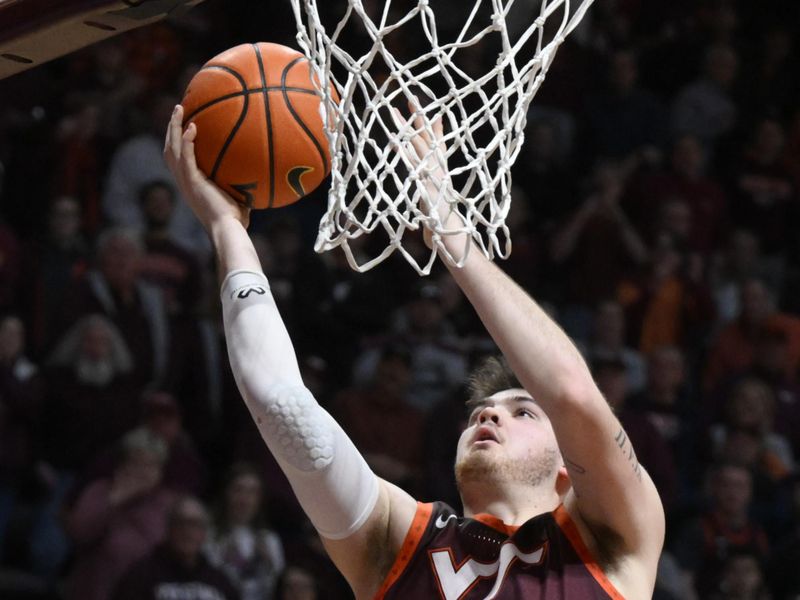 Feb 4, 2023; Blacksburg, Virginia, USA; Virginia Tech Hokies forward Grant Basile (21) drives to basket in the second half against the Virginia Cavaliers at Cassell Coliseum. Mandatory Credit: Lee Luther Jr.-USA TODAY Sports