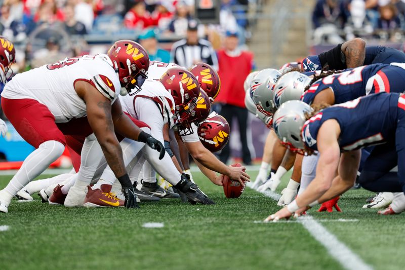 Washington Commanders long snapper Camaron Cheeseman (54) prepares to hike the ball at the line of scrimmage during the second half an NFL football game against the New England Patriots on Sunday, Nov. 5, 2023, in Foxborough, Mass. (AP Photo/Greg M. Cooper)