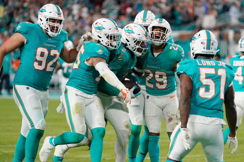 Miami Dolphins linebacker Bradley Chubb (2) celebrates recovering the football following a fumble by Tennessee Titans quarterback Will Levis during the second half of an NFL football game, Monday, Dec. 11, 2023, in Miami. (AP Photo/Lynne Sladky)