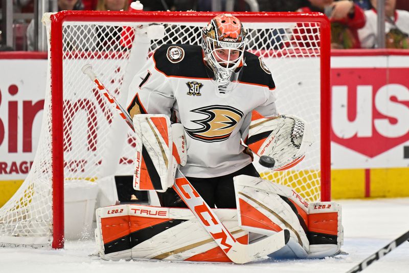 Dec 7, 2023; Chicago, Illinois, USA; Anaheim Ducks goaltender Lukas Dostal (1) tracks the puck for a save on a shot from the Chicago Blackhawks in the first period at United Center. Mandatory Credit: Jamie Sabau-USA TODAY Sports