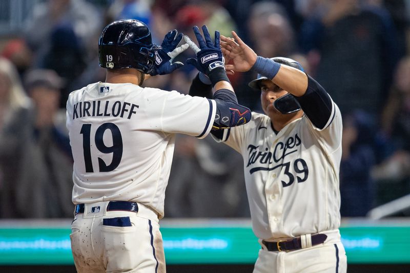 Sep 26, 2023; Minneapolis, Minnesota, USA; Minnesota Twins first baseman Alex Kirilloff (19) celebrates with third baseman Donovan Solano (39) after hitting a two run home run against the Oakland Athletics in the fifth inning at Target Field. Mandatory Credit: Jesse Johnson-USA TODAY Sports