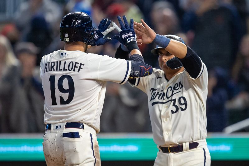 Sep 26, 2023; Minneapolis, Minnesota, USA; Minnesota Twins first baseman Alex Kirilloff (19) celebrates with third baseman Donovan Solano (39) after hitting a two run home run against the Oakland Athletics in the fifth inning at Target Field. Mandatory Credit: Jesse Johnson-USA TODAY Sports