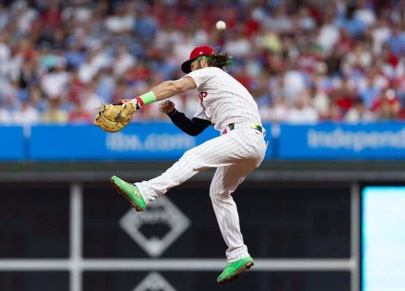 Aug 4, 2023; Philadelphia, Pennsylvania, USA; Philadelphia Phillies designated hitter Bryce Harper (3) leaps and misses the single of Kansas City Royals third baseman Maikel Garcia (not pictured) during the third inning at Citizens Bank Park. Mandatory Credit: Bill Streicher-USA TODAY Sports