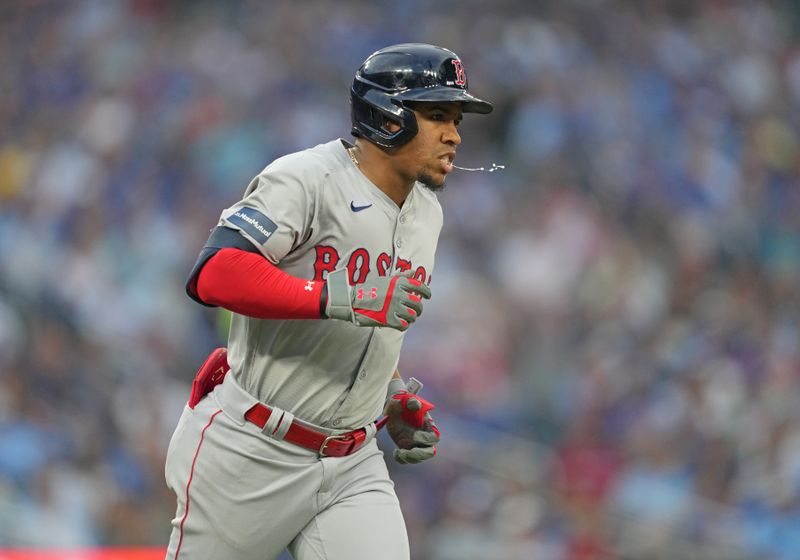 Jun 19, 2024; Toronto, Ontario, CAN; Boston Red Sox second base Enmanuel Valdez (47) runs the bases after hitting a home run against the Toronto Blue Jays during fourth inning at Rogers Centre. Mandatory Credit: Nick Turchiaro-USA TODAY Sports