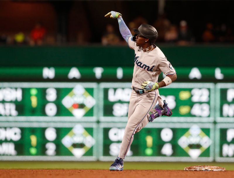 Sep 30, 2023; Pittsburgh, Pennsylvania, USA; Miami Marlins center fielder Jazz Chisholm Jr. (2) reacts as he circles the bases on a solo home run against the Pittsburgh Pirates during the third inning at PNC Park. Mandatory Credit: Charles LeClaire-USA TODAY Sports