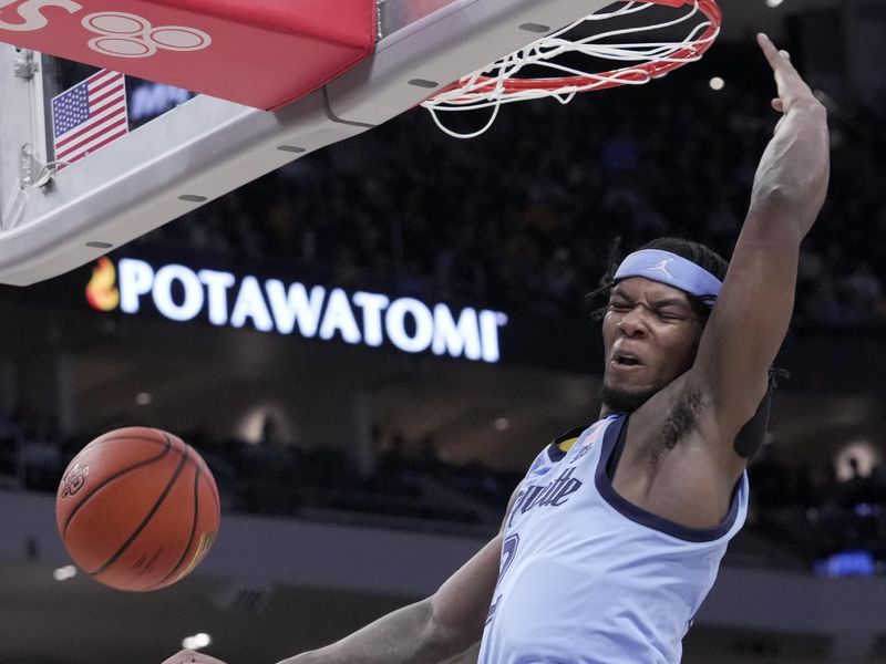 Nov 19, 2024; Milwaukee, Wisconsin, USA; Marquette guard Chase Ross (2) throws down a dunk  during the first half at Fiserv Forum. Mandatory Credit: Mark Hoffman/USA TODAY Network via Imagn Imagesl-Imagn Images