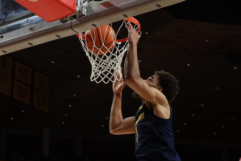 Feb 27, 2023; Ames, Iowa, USA; West Virginia Mountaineers forward Emmitt Matthews Jr. (1) scores against the Iowa State Cyclones during the first half at James H. Hilton Coliseum. Mandatory Credit: Reese Strickland-USA TODAY Sports