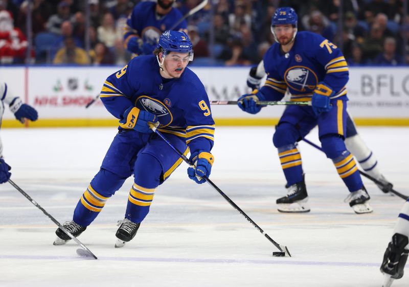 Dec 21, 2023; Buffalo, New York, USA;  Buffalo Sabres left wing Zach Benson (9) skates up ice with the puck during the second period against the Toronto Maple Leafs at KeyBank Center. Mandatory Credit: Timothy T. Ludwig-USA TODAY Sports