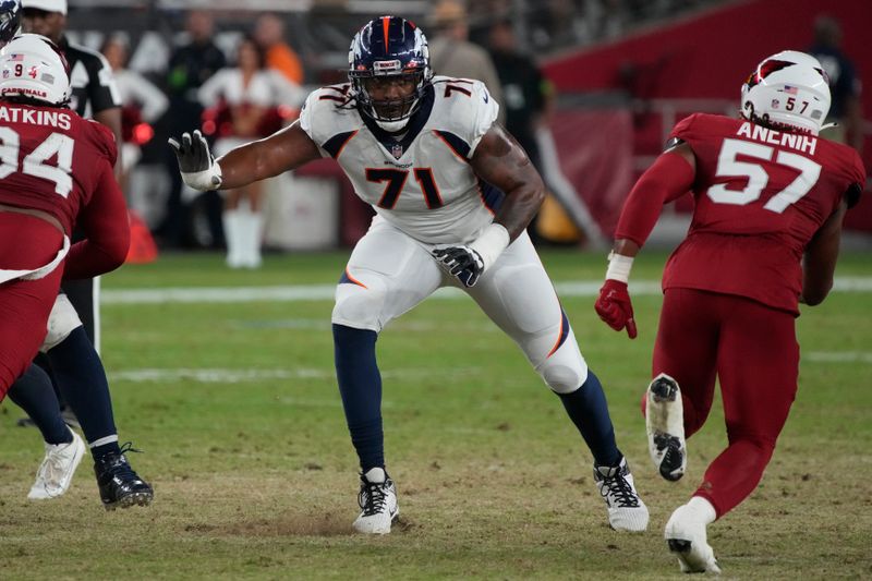 Denver Broncos offensive tackle Demontrey Jacobs (71) lines up during an NFL pre-season game against the Arizona Cardinals, Friday, Aug. 11, 2023, in Glendale, Ariz. (AP Photo/Rick Scuteri)