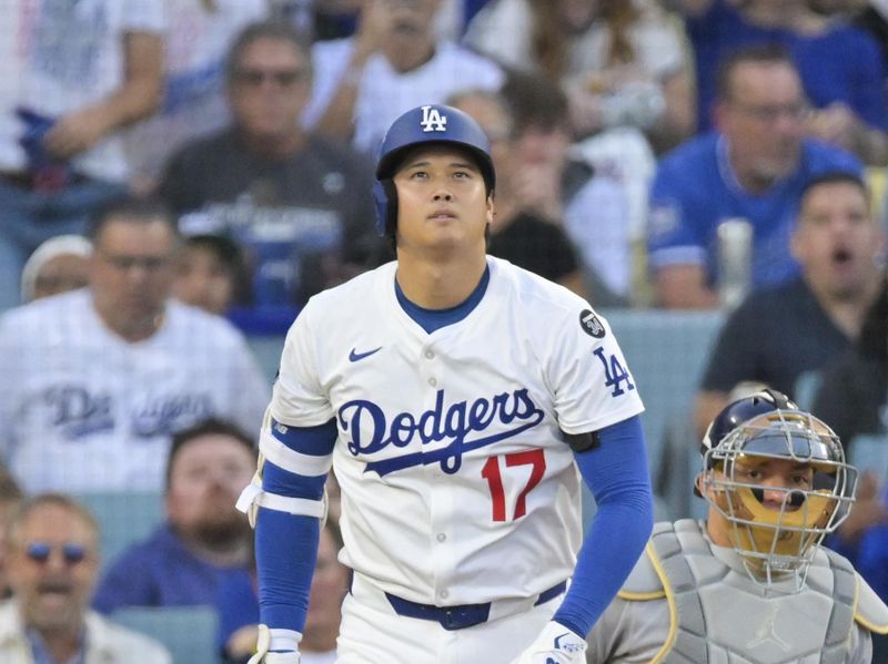 Oct 17, 2025; Los Angeles, California, USA;Los Angeles Dodgers two-way player Shohei Ohtani (17) watches his home run against the Milwaukee Brewers during the first inning of game four of the NLCS round for the 2025 MLB playoffs at Dodger Stadium. Mandatory Credit: Jayne Kamin-Oncea-Imagn Images