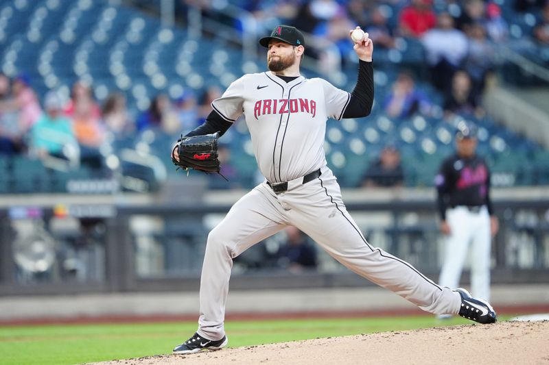 May 31, 2024; New York City, New York, USA; Arizona Diamondbacks pitcher Jordan Montgomery (52) delivers a pitch against the New York Mets during the first inning at Citi Field. Mandatory Credit: Gregory Fisher-USA TODAY Sports