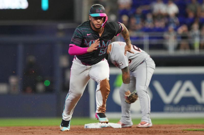 Sep 13, 2025; Miami, Florida, USA;  Miami Marlins designated hitter Agustin Ramirez (50) advances to third base on a throwing error by Detroit in the first inning at loanDepot Park. Mandatory Credit: Jim Rassol-Imagn Images