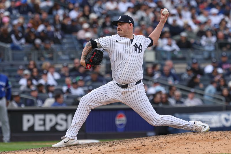 Apr 27, 2025; Bronx, New York, USA; New York Yankees relief pitcher Tyler Matzek (68) delivers a pitch during the ninth inning against the Toronto Blue Jays at Yankee Stadium. Mandatory Credit: Vincent Carchietta-Imagn Images
