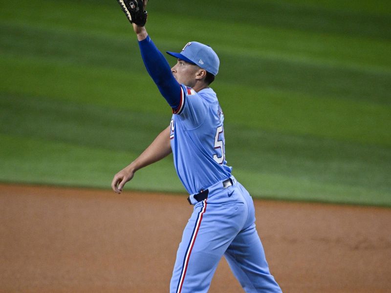 Sep 1, 2024; Arlington, Texas, USA; Texas Rangers first baseman Justin Foscue (56) fields a throw to first base during the first inning against the Oakland Athletics at Globe Life Field. Mandatory Credit: Jerome Miron-USA TODAY Sports