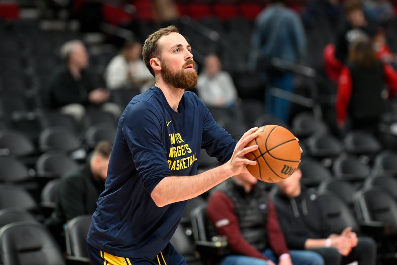 PORTLAND, OREGON - MARCH 23: Jay Huff #30 of the Denver Nuggets warms up before the game against the Portland Trail Blazers at the Moda Center on March 23, 2024 in Portland, Oregon. NOTE TO USER: User expressly acknowledges and agrees that, by downloading and or using this photograph, User is consenting to the terms and conditions of the Getty Images License Agreement. (Photo by Alika Jenner/Getty Images)