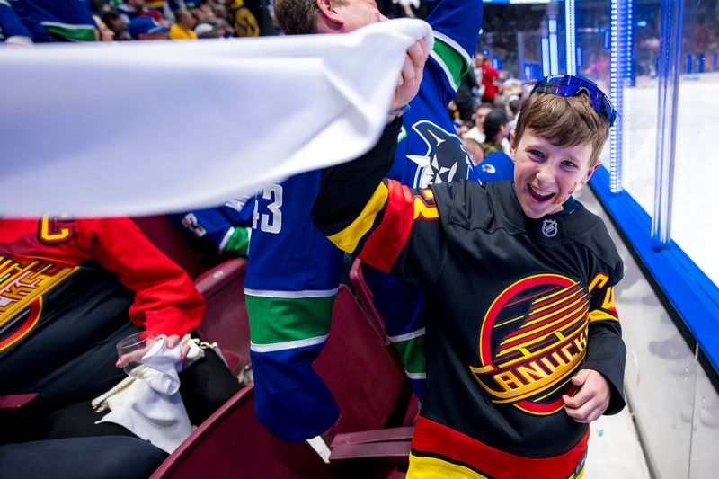 Apr 21, 2024; Vancouver, British Columbia, CAN; Fans cheer during a game between the Vancouver Canucks and the Nashville Predators in the third period in game one of the first round of the 2024 Stanley Cup Playoffs at Rogers Arena.  Mandatory Credit: Bob Frid-USA TODAY Sports