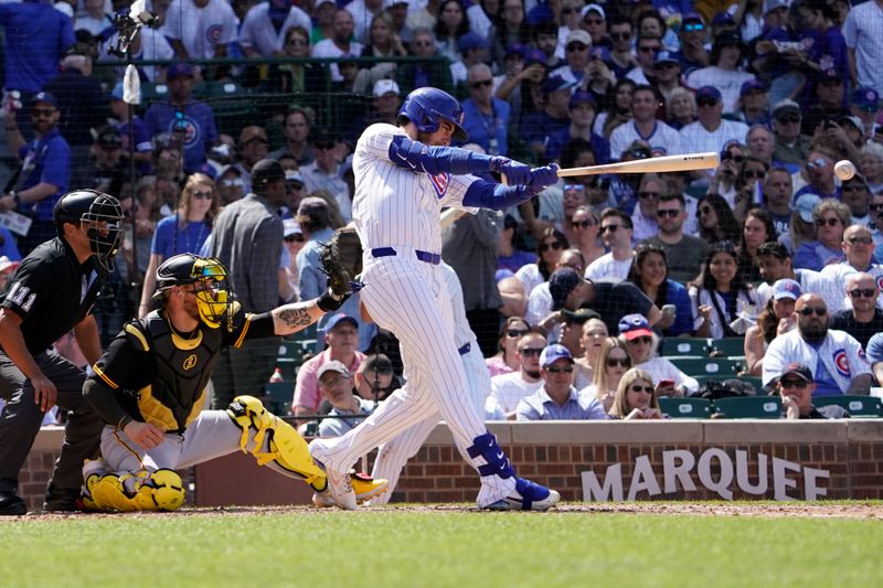 May 19, 2024; Chicago, Illinois, USA; Chicago Cubs outfielder Cody Bellinger (24) hits a double against the Pittsburgh Pirates during the sixth inning at Wrigley Field. Mandatory Credit: David Banks-USA TODAY Sports