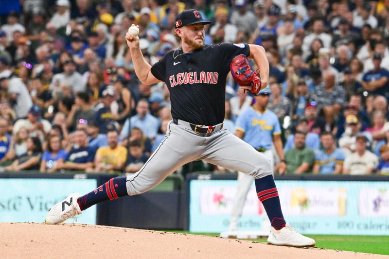 Aug 17, 2024; Milwaukee, Wisconsin, USA; Cleveland Guardians starting pitcher Tanner Bibee (28) pitches against the Milwaukee Brewers in the first inning at American Family Field. Mandatory Credit: Benny Sieu-USA TODAY Sports