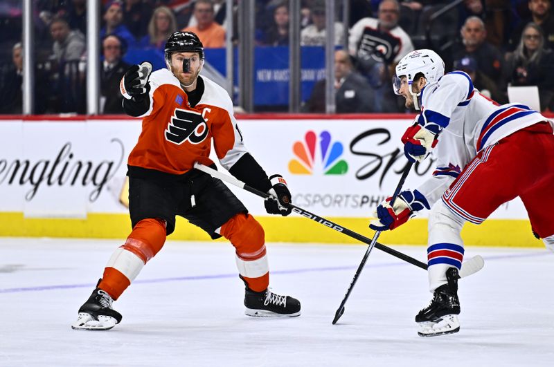 Feb 24, 2024; Philadelphia, Pennsylvania, USA; Philadelphia Flyers center Sean Couturier (14) reaches for the puck against New York Rangers defenseman Jacob Trouba (8) in the third period at Wells Fargo Center. Mandatory Credit: Kyle Ross-USA TODAY Sports