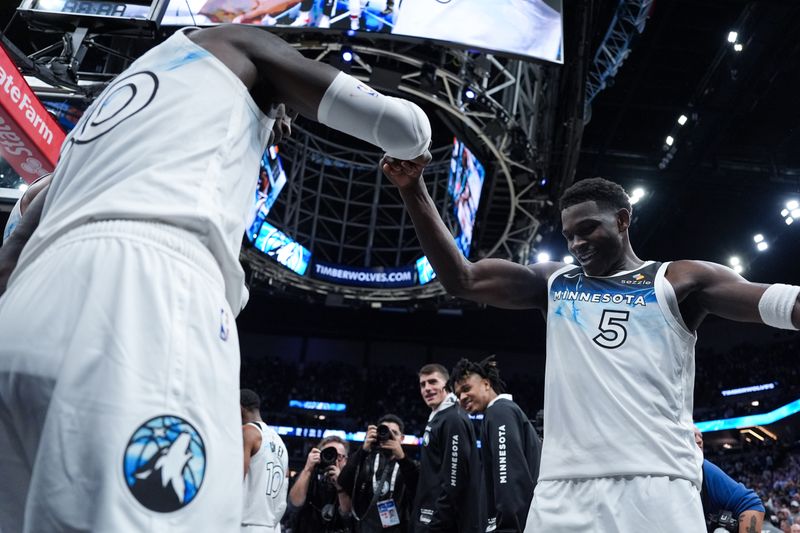 MINNEAPOLIS, MN -  NOVEMBER 17: Julius Randle #30 and Anthony Edwards #5 of the Minnesota Timberwolves celebrates after making the game winning three point buzzer beater basket during the game against the Phoenix Suns on November 17, 2024 at Target Center in Minneapolis, Minnesota. NOTE TO USER: User expressly acknowledges and agrees that, by downloading and or using this Photograph, user is consenting to the terms and conditions of the Getty Images License Agreement. Mandatory Copyright Notice: Copyright 2024 NBAE (Photo by Jordan Johnson/NBAE via Getty Images)