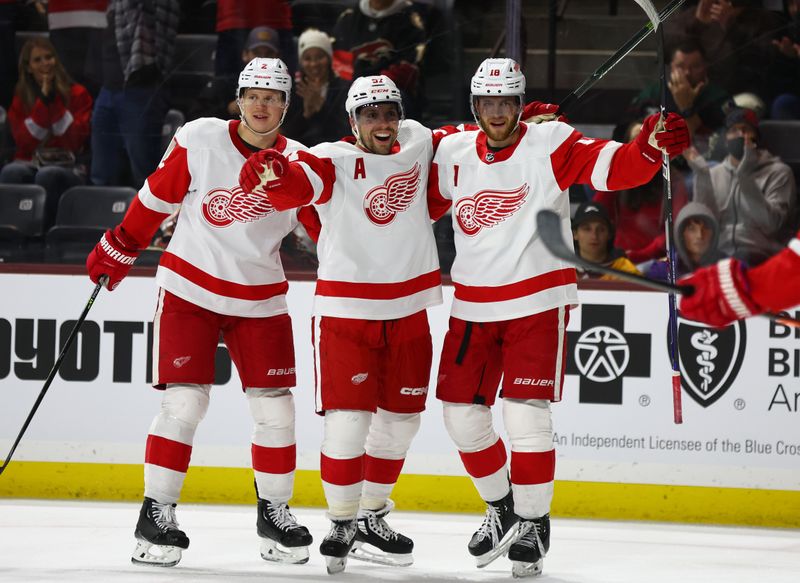 Jan 17, 2023; Tempe, Arizona, USA; Detroit Red Wings left wing David Perron (57) celebrates a goal with center Andrew Copp (18) and defenseman Olli Maatta (2) against the Arizona Coyotes in the third period at Mullett Arena. Mandatory Credit: Mark J. Rebilas-USA TODAY Sports