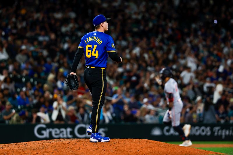 May 30, 2025; Seattle, Washington, USA; Seattle Mariners relief pitcher Casey Legumina (64) stands on the mound after surrendering a two-run home run against the Minnesota Twins on the first pitch of the tenth inning at T-Mobile Park. Mandatory Credit: Joe Nicholson-Imagn Images